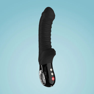 a large black object is floating in the air